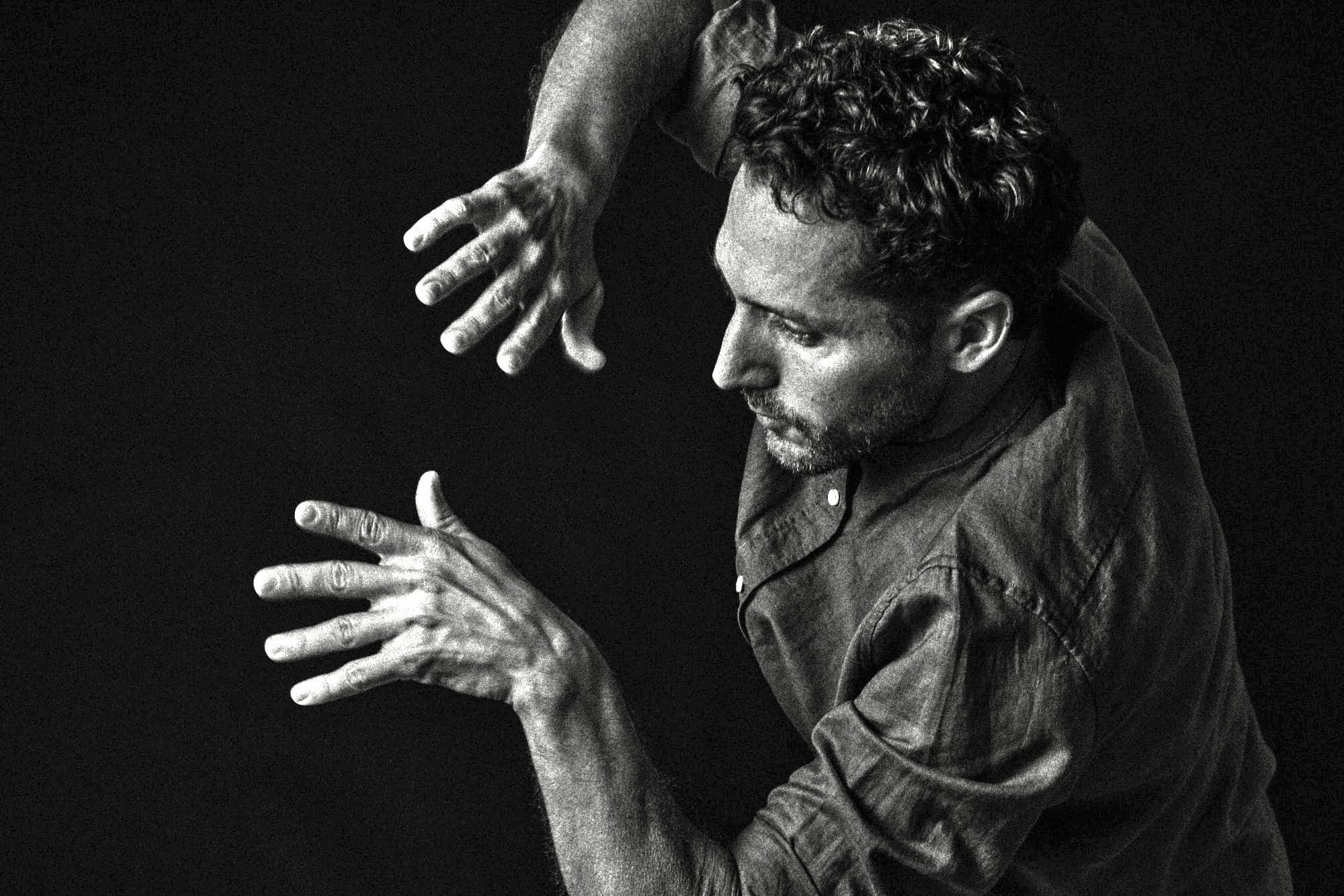 Yshai Afterman, hands raised mid-stroke